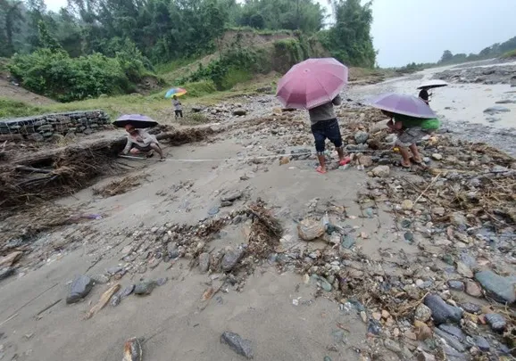 Loss assessor at flood-impacted site
